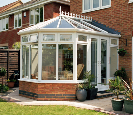 Victorian Conservatory with patio across garden